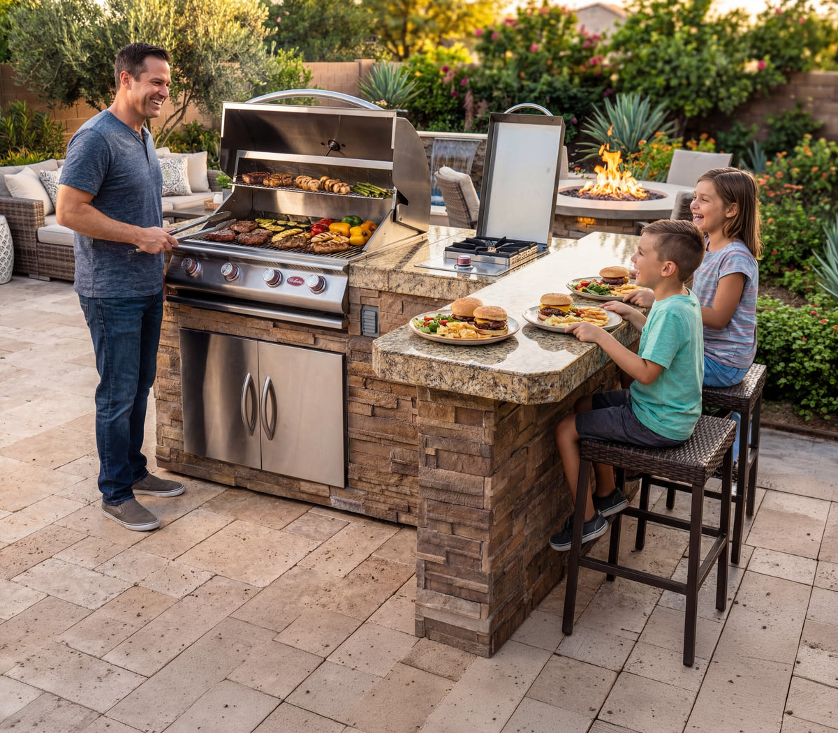 Cal Flame Malibu BBQ island outdoor kitchen lifestyle with people entertaining