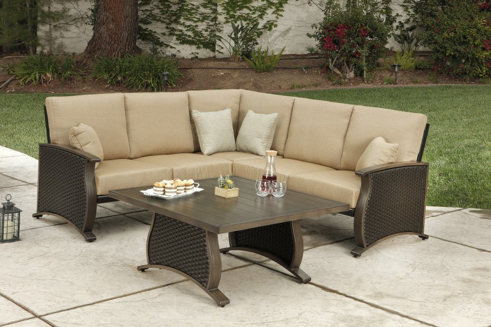 Two Piece Brown and Tan Metal Sectional Seating Group With Table