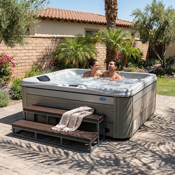 Cal Spas Kona PZ-519L 3-person plug and play hot tub lifestyle photo on premium patio