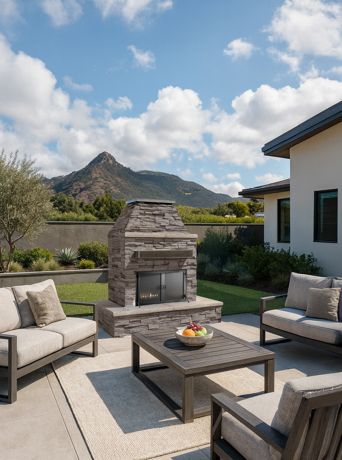 Cal Flame Key West outdoor gas fireplace with brick surround and screen on a patio