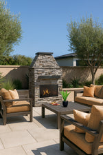 Cal Flame Laredo 48-inch outdoor gas fireplace with brick surround and screen on a patio